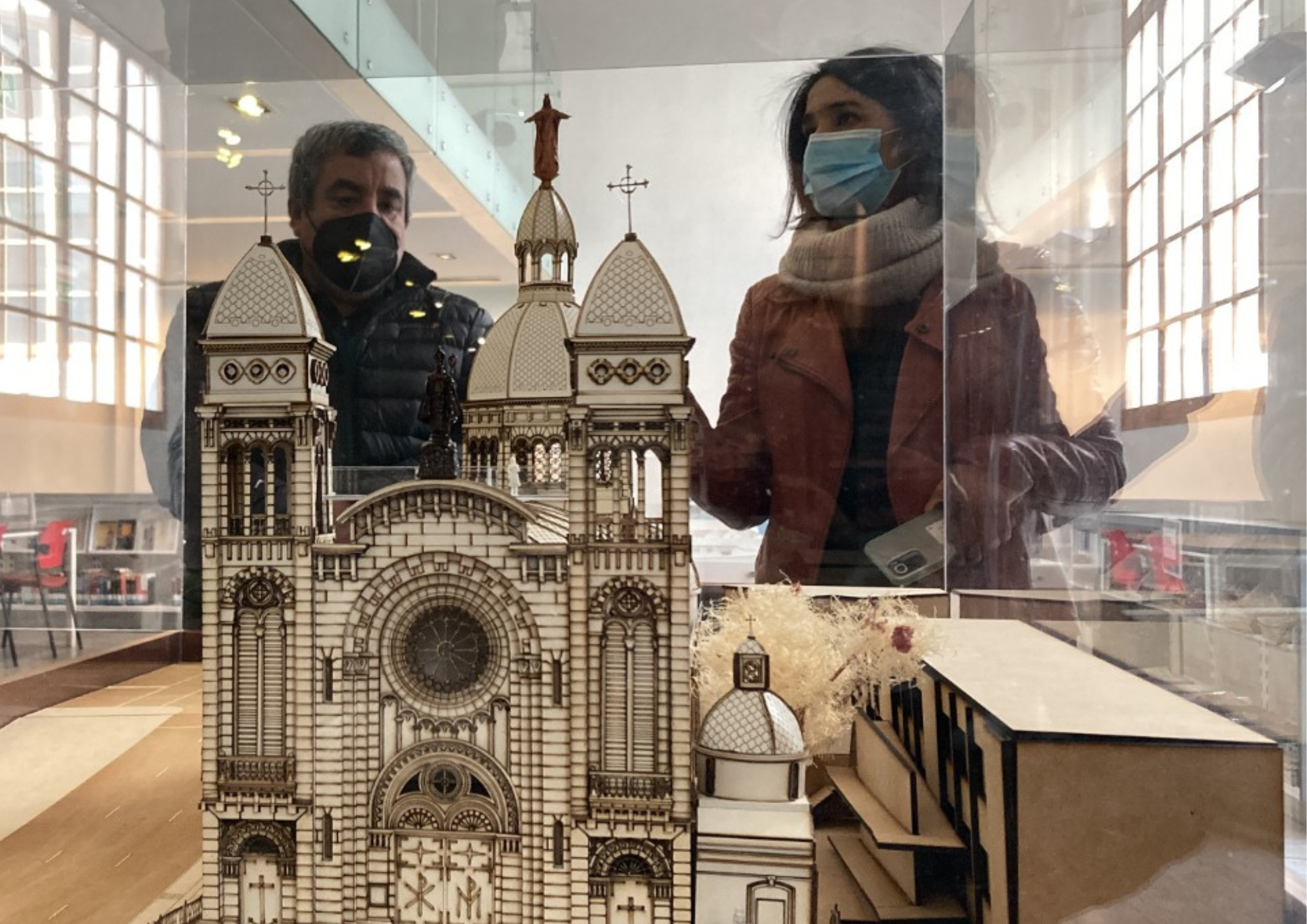 Architectural scale model of a basilica viewed by visitors